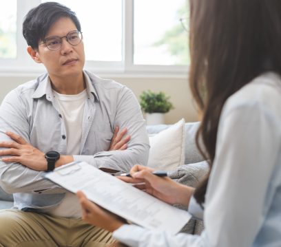 Psychology, depression. Sad, suffering asian young man, male consulting with psychologist, psychiatrist while patient counseling mental problem with doctor at clinic. Encouraging, therapy, health care